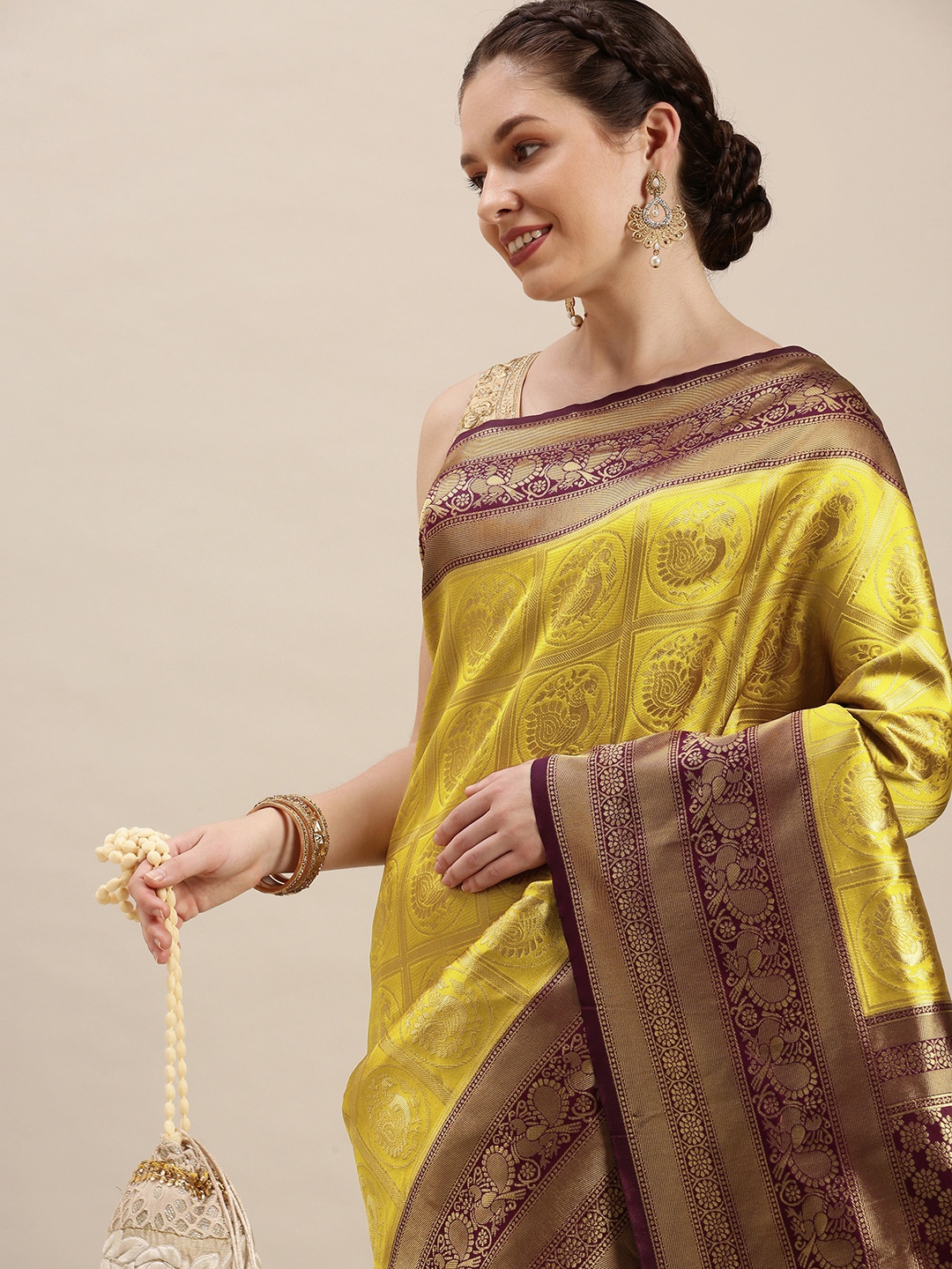

Rudra Fashion Yellow & Purple Ethnic Motifs Silk Blend Banarasi Saree