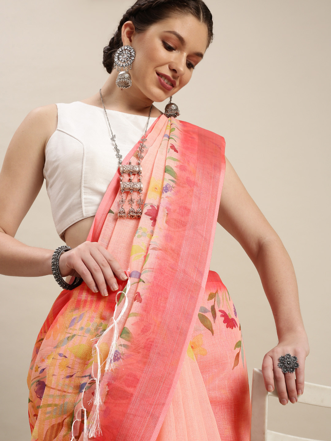

Rudra Fashion Peach-Coloured & Yellow Floral Linen Blend Ikat Saree