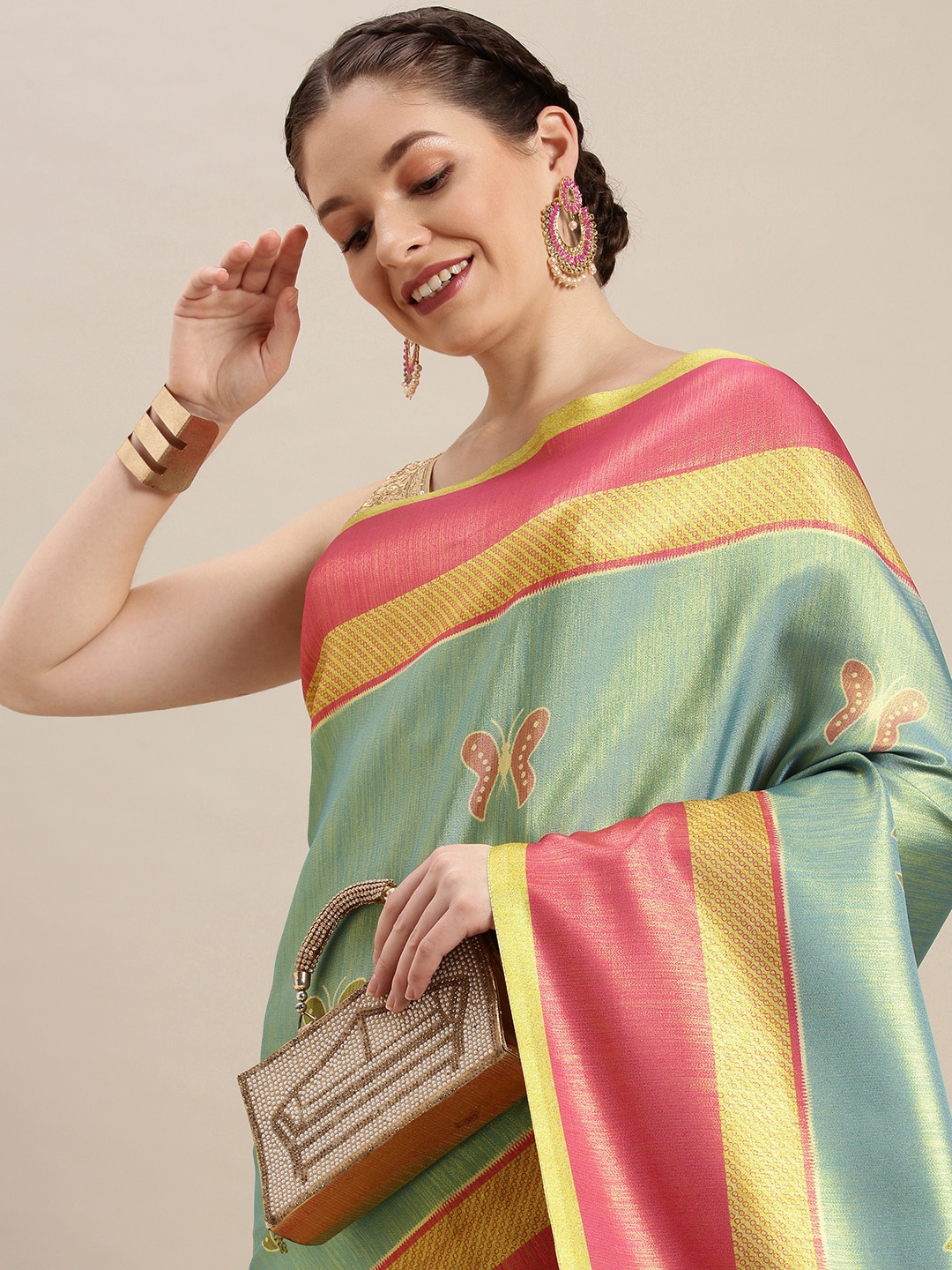 

Rudra Fashion Sea Green & Pink Ethnic Motifs Silk Blend Ikat Saree
