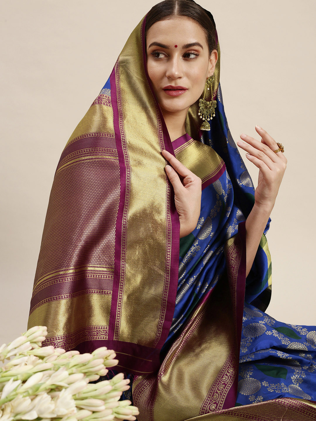 

Rudra Fashion Blue & Purple Ethnic Motifs Silk Blend Banarasi Saree