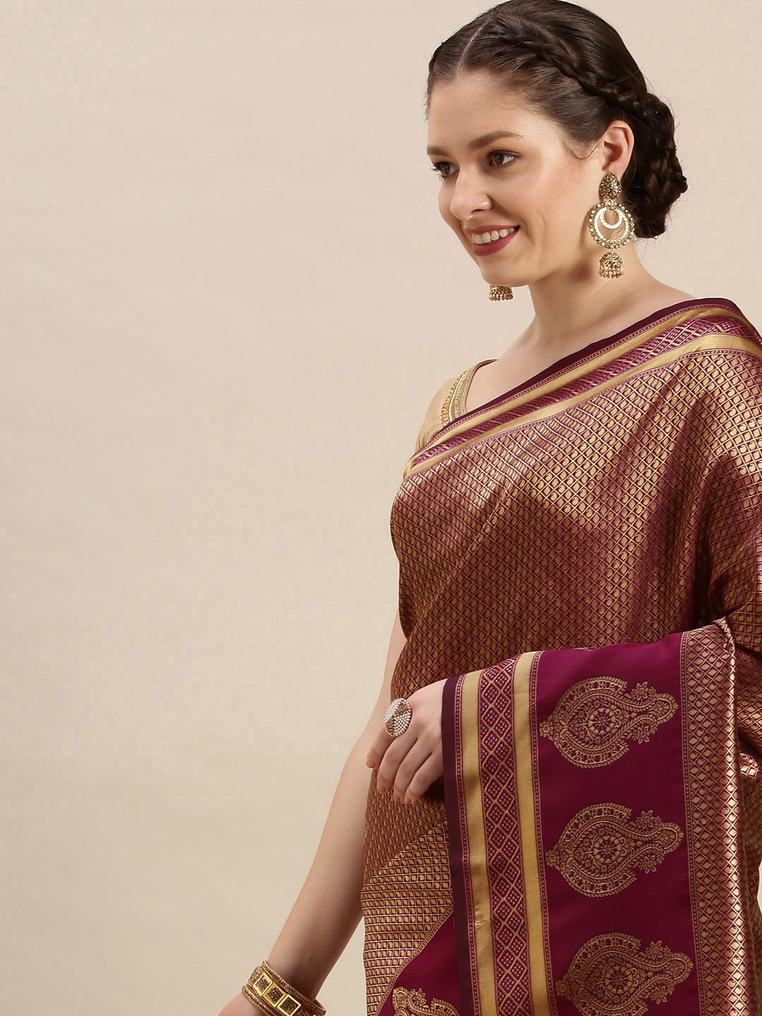 

Rudra Fashion Purple & Gold-Toned Ethnic Motifs Silk Blend Banarasi Saree