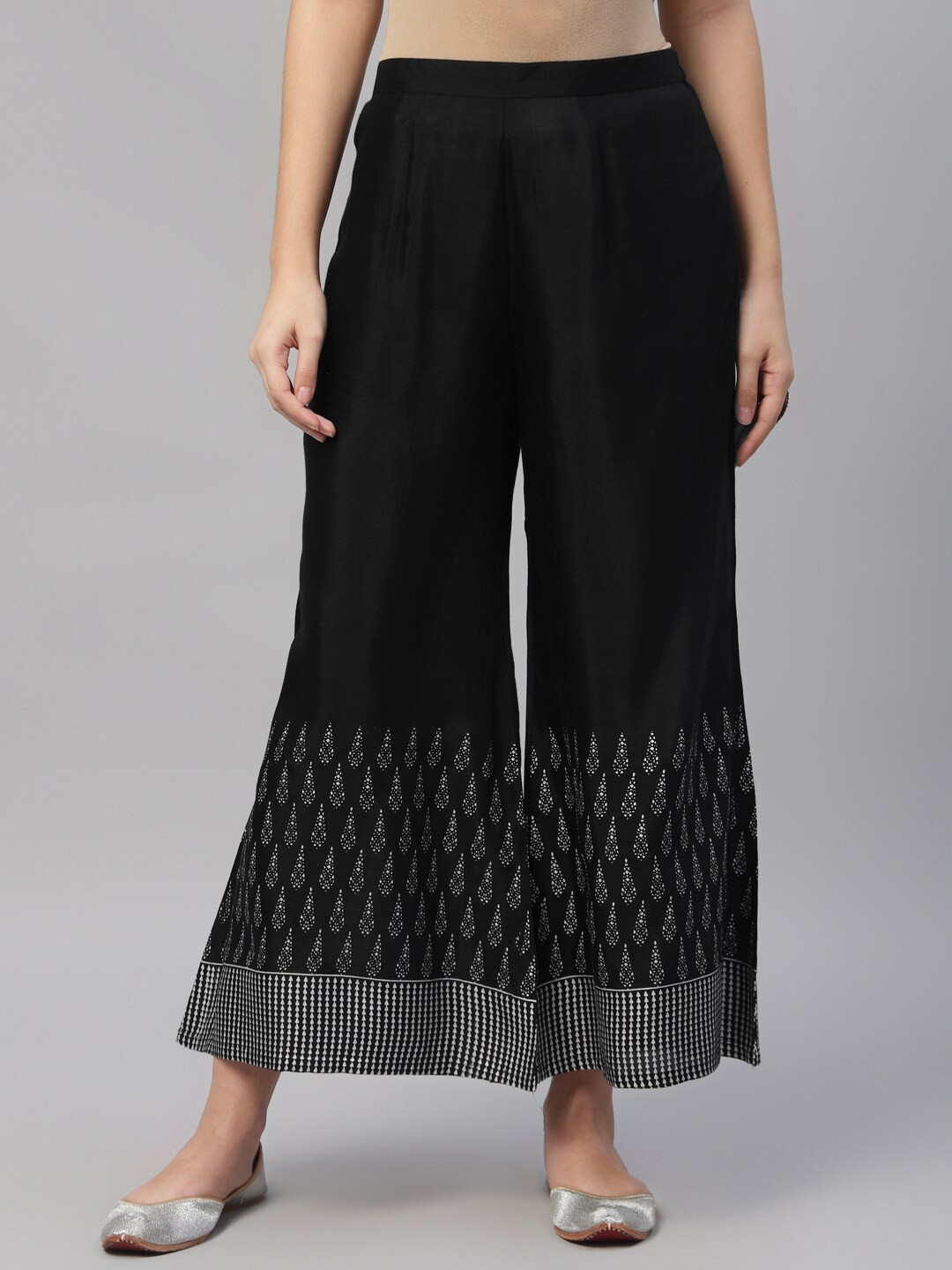 

Libas Women Black & Silver-Toned Ethnic Motifs Printed Ethnic Palazzos