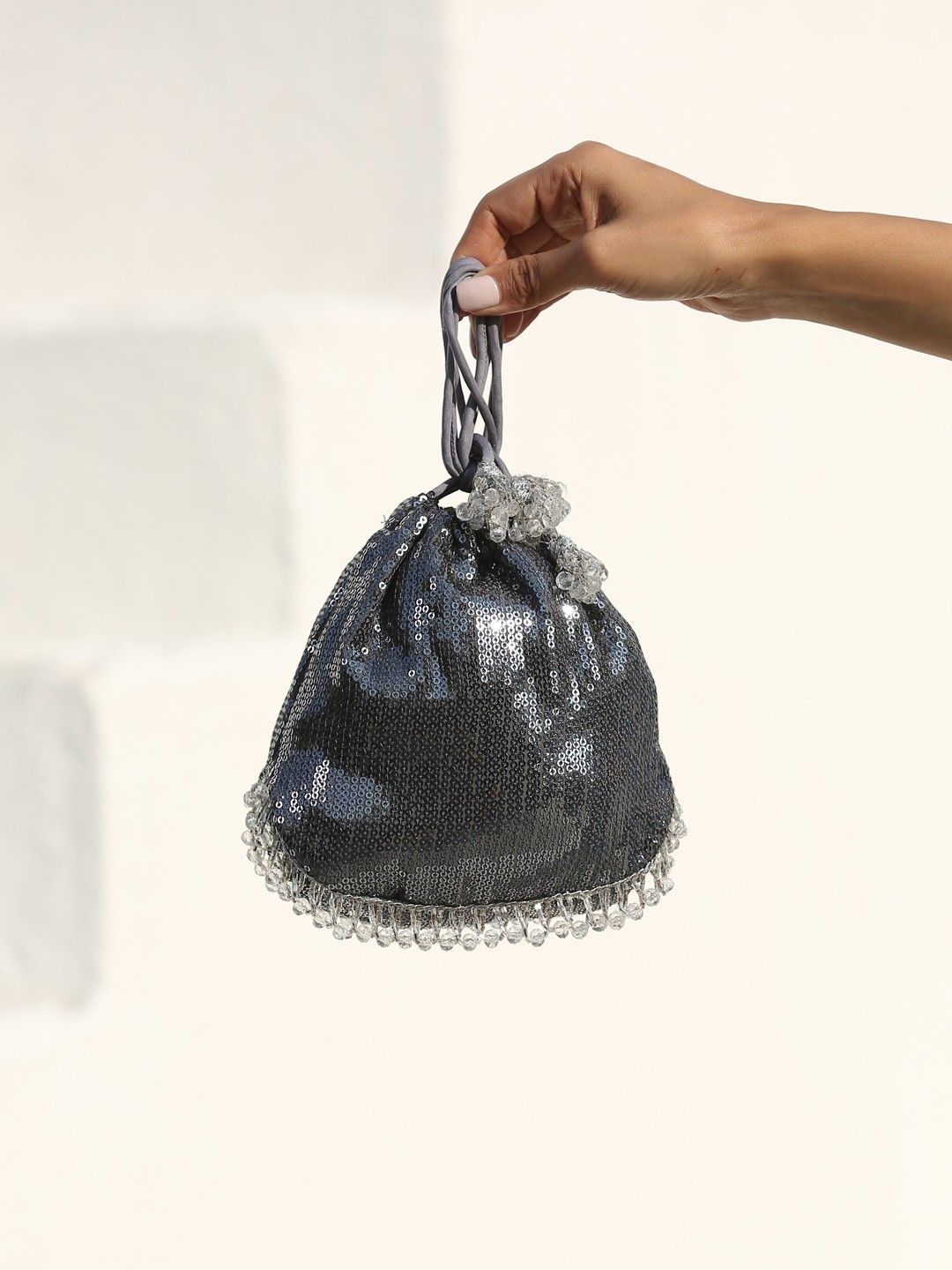 

Swtantra Grey Bucket Shoulder Bag with Tasselled