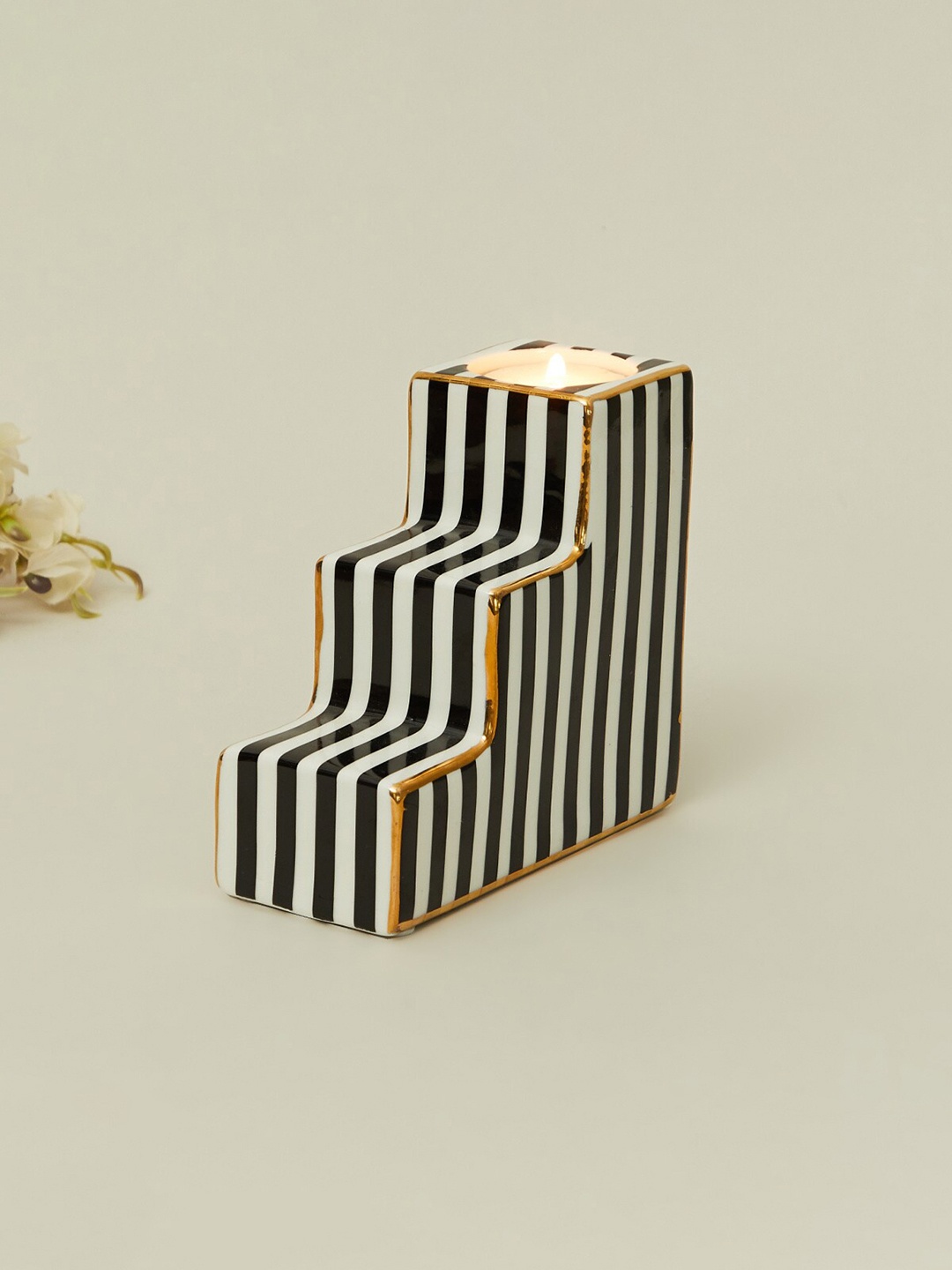 

Home Centre Black & White Striped Ceramic Candle Holder