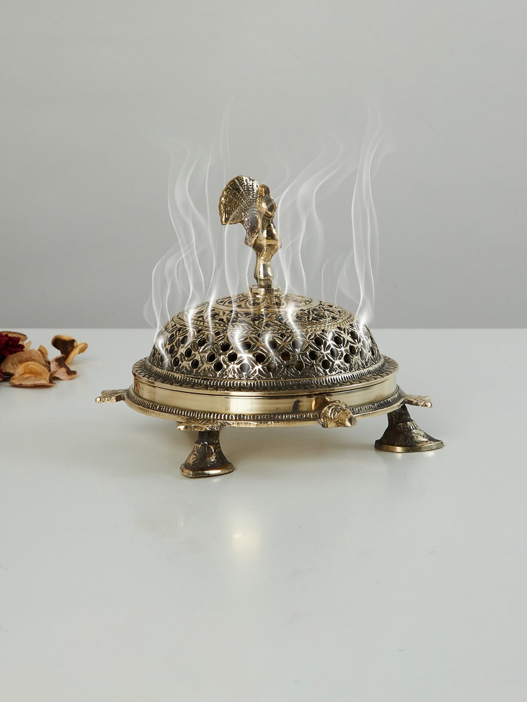 

Home Centre Gold-Toned Brass Dhoop Dani With Peacock Accent