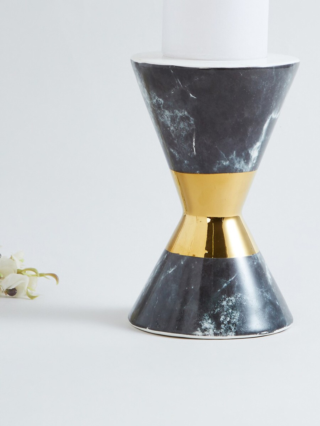 

Home Centre Black & Gold-Toned Patterned Ceramic Candle Holder