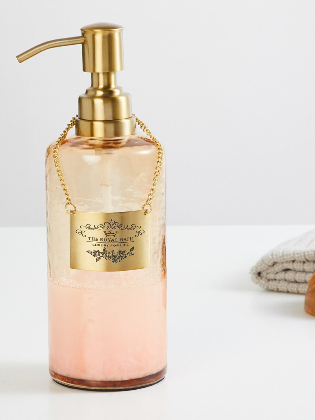 

Home Centre Peach & Gold Printed Glass Soap Dispenser