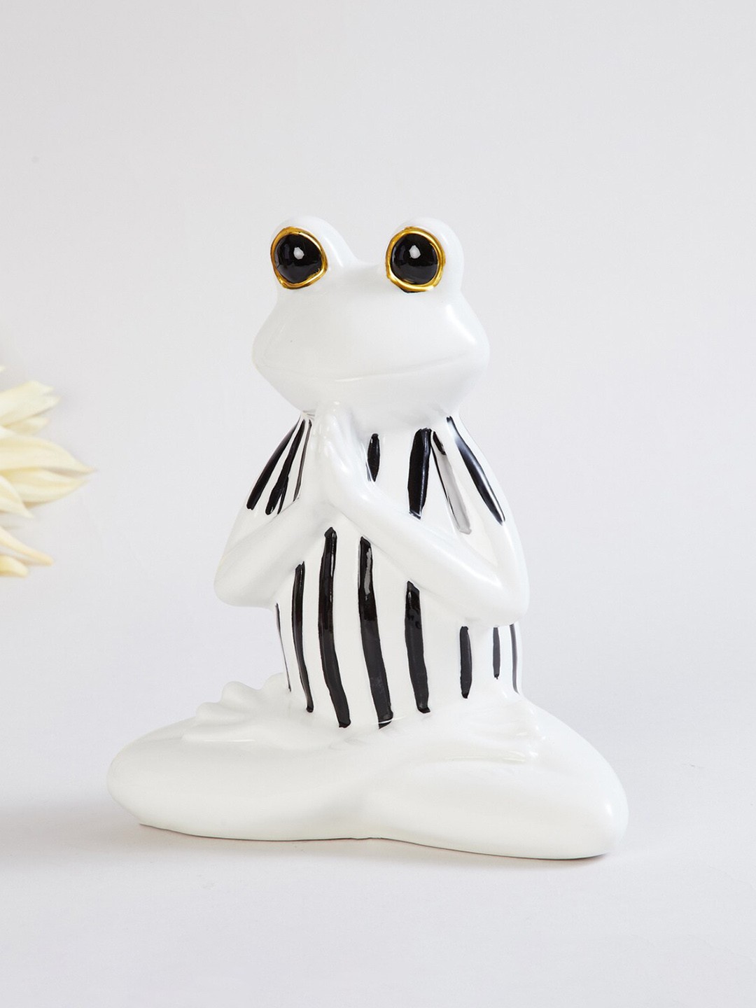 

Home Centre White & Black Ceramic Frog Showpiece