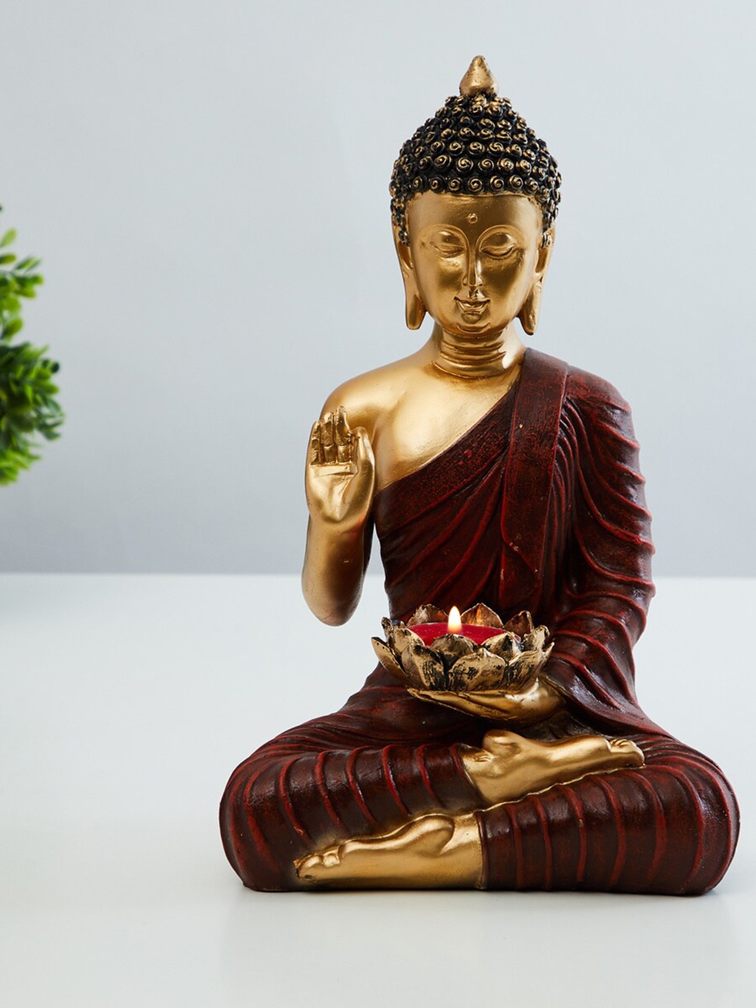 

Home Centre Red & Gold-Toned Buddha Showpiece Cum Tealight Holder