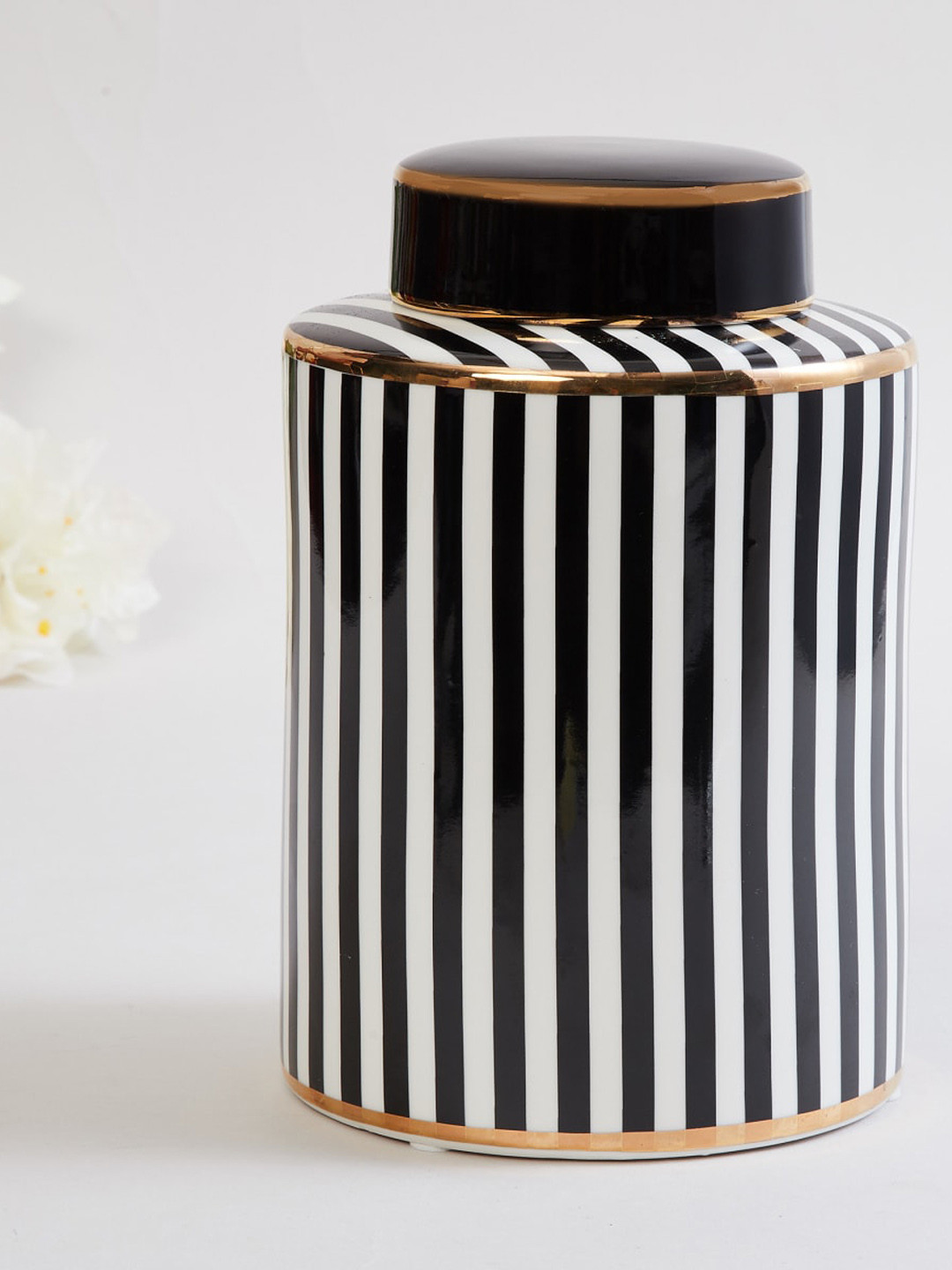 

Home Centre White & Black Striped Ceramic Decorative Canister With Lid