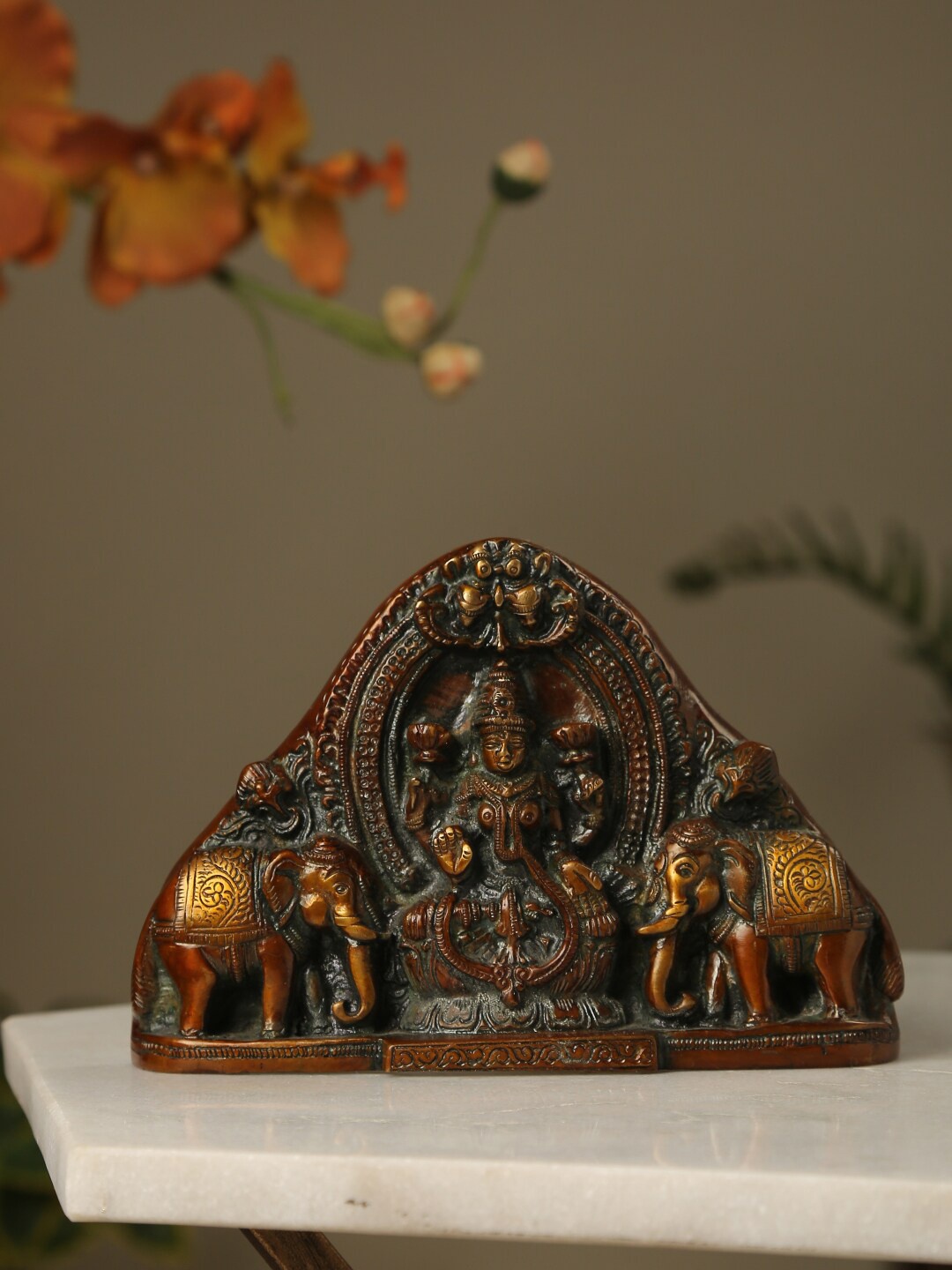 

Amoliconcepts Gold-Toned Lakshmi Statue With Elephants Idol Showpieces