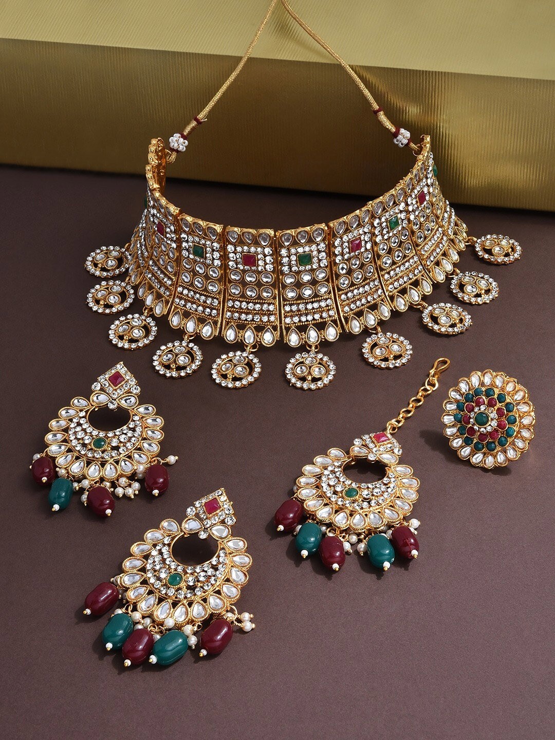 

Zaveri Pearls Gold-Plated Green & Red Kundan Beaded Bridal Jewellery Set