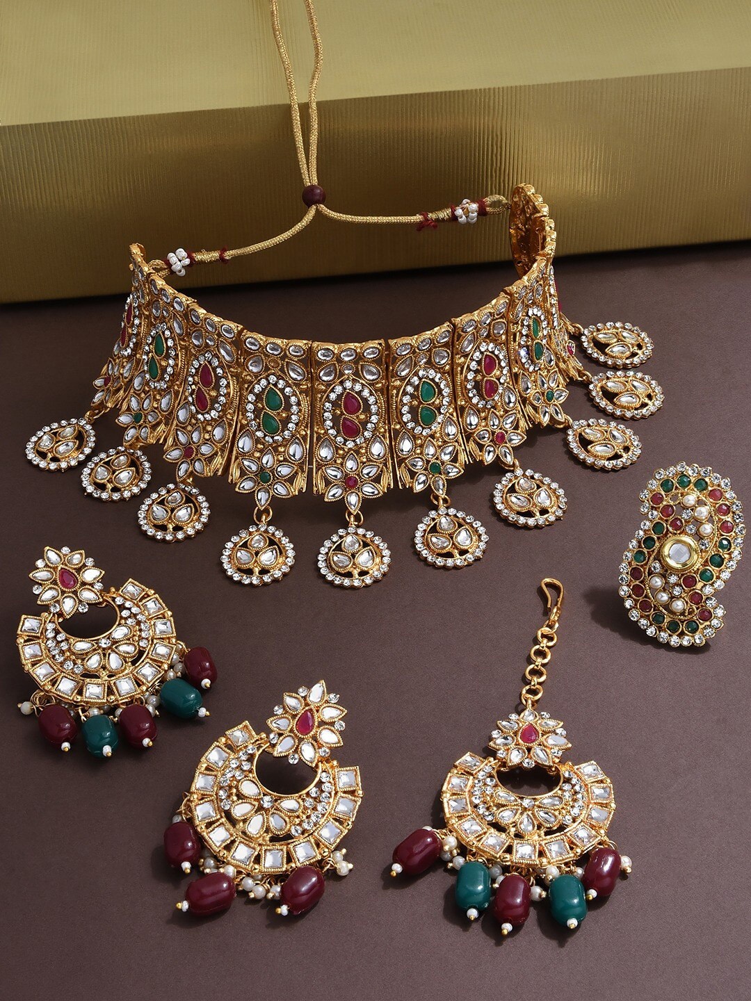 

Zaveri Pearls Gold-Plated White & Green Stone-Studded & Pearl Beaded Jewellery Set