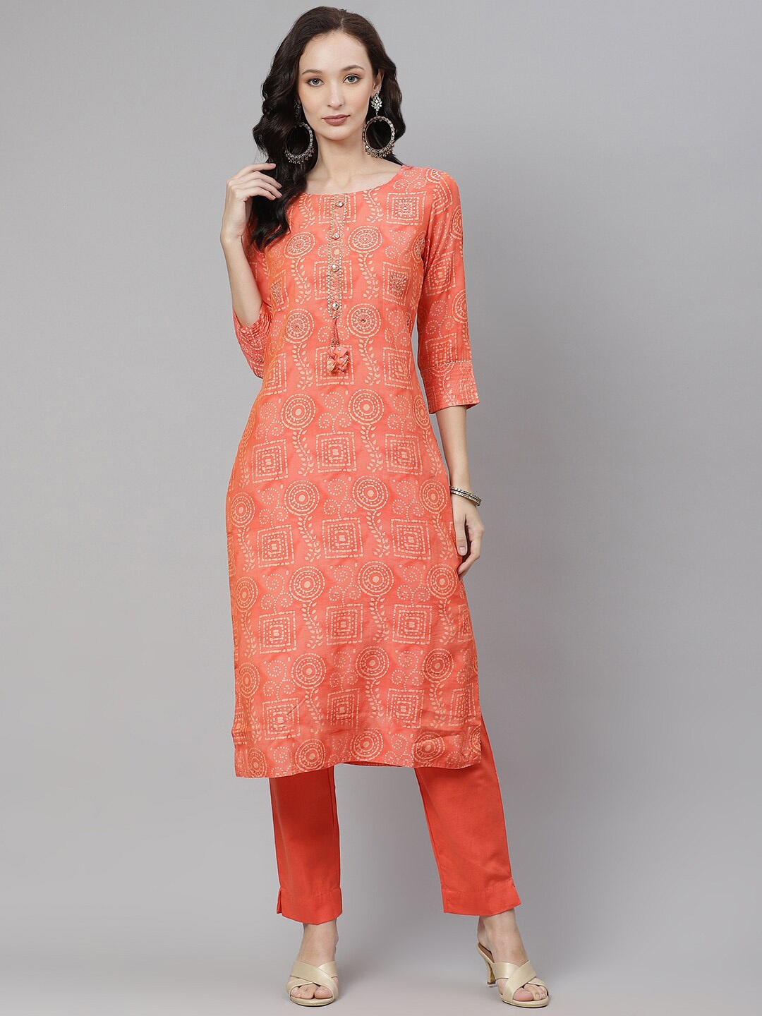 

Divena Women Peach-Coloured Embroidered Mirror Work Kurta with Trousers