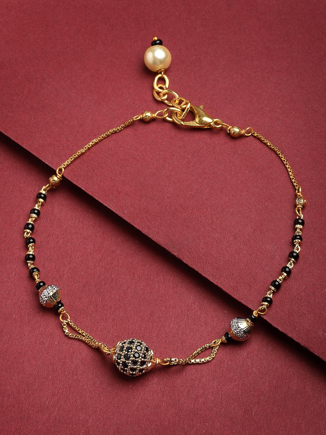 

PANASH Gold-Plated Black Stone-Studded & Beaded Hand Mangalsutra
