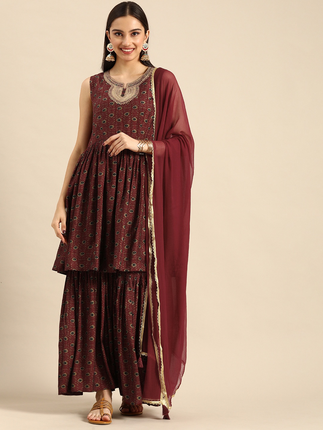 

Anouk Women Maroon Ethnic Motifs Printed Thread Work Kurta with Sharara & Dupatta