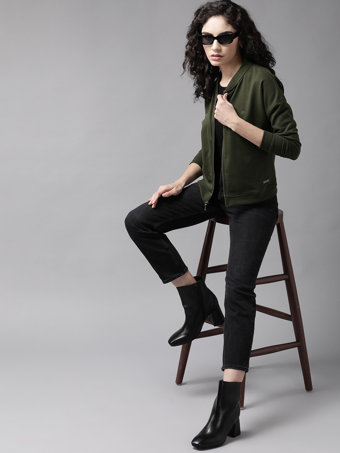 

Roadster Women Olive Green Solid Sweatshirt