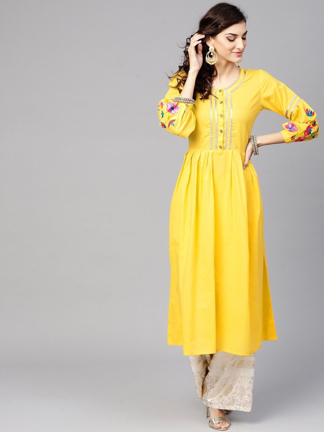 

Tulsattva Women Yellow Flared Sleeves Asymmetric Kurta