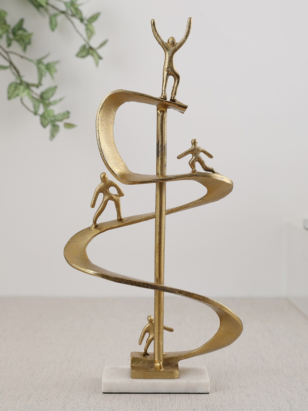

HomeTown Gold-Toned Human Figurine Showpiece