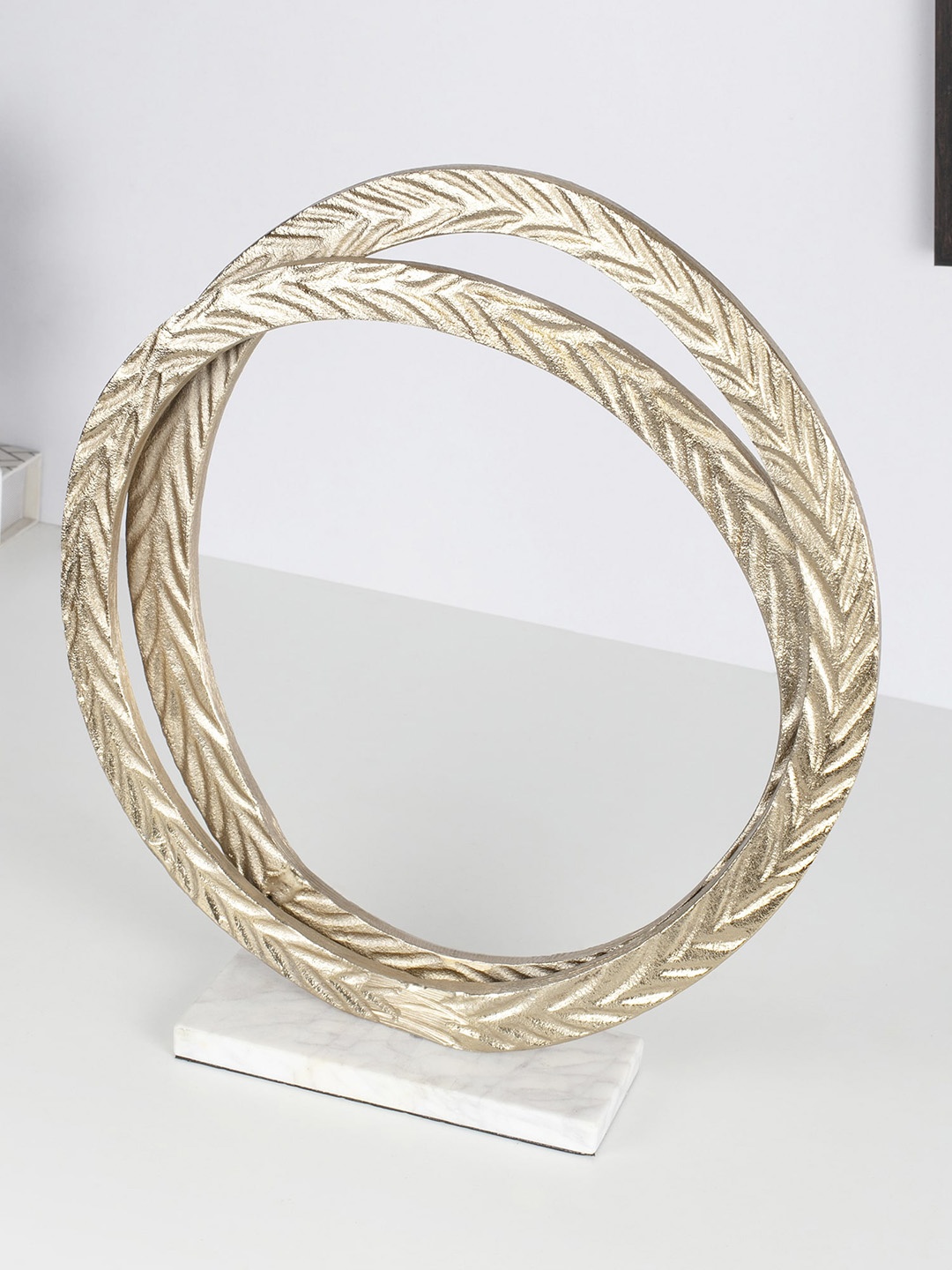 

HomeTown Gold-Toned Textured Nyra Metal Decor Showpiece