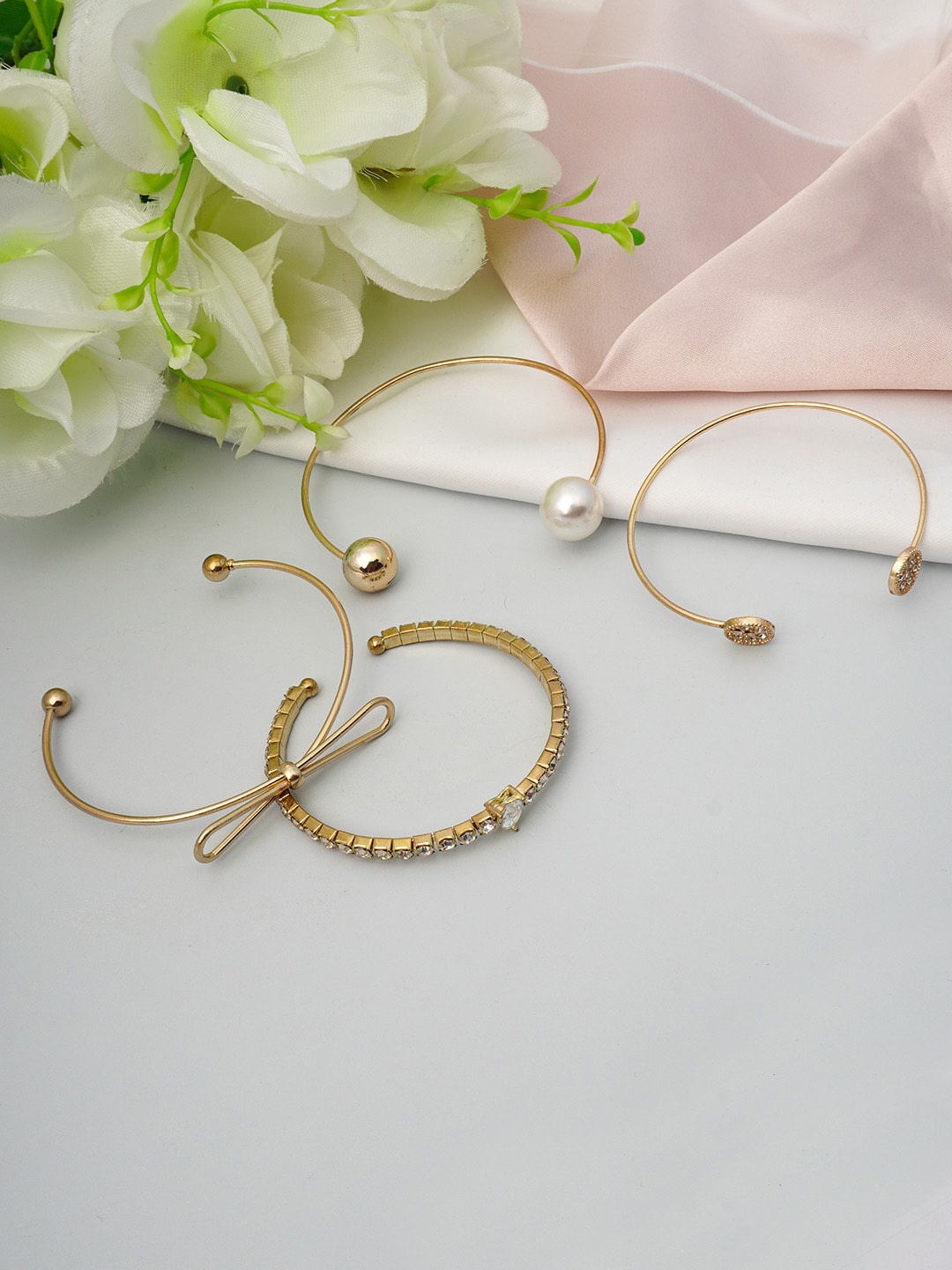 

Ferosh Women Set Of 4 Gold-Toned & White Cuff Bracelet
