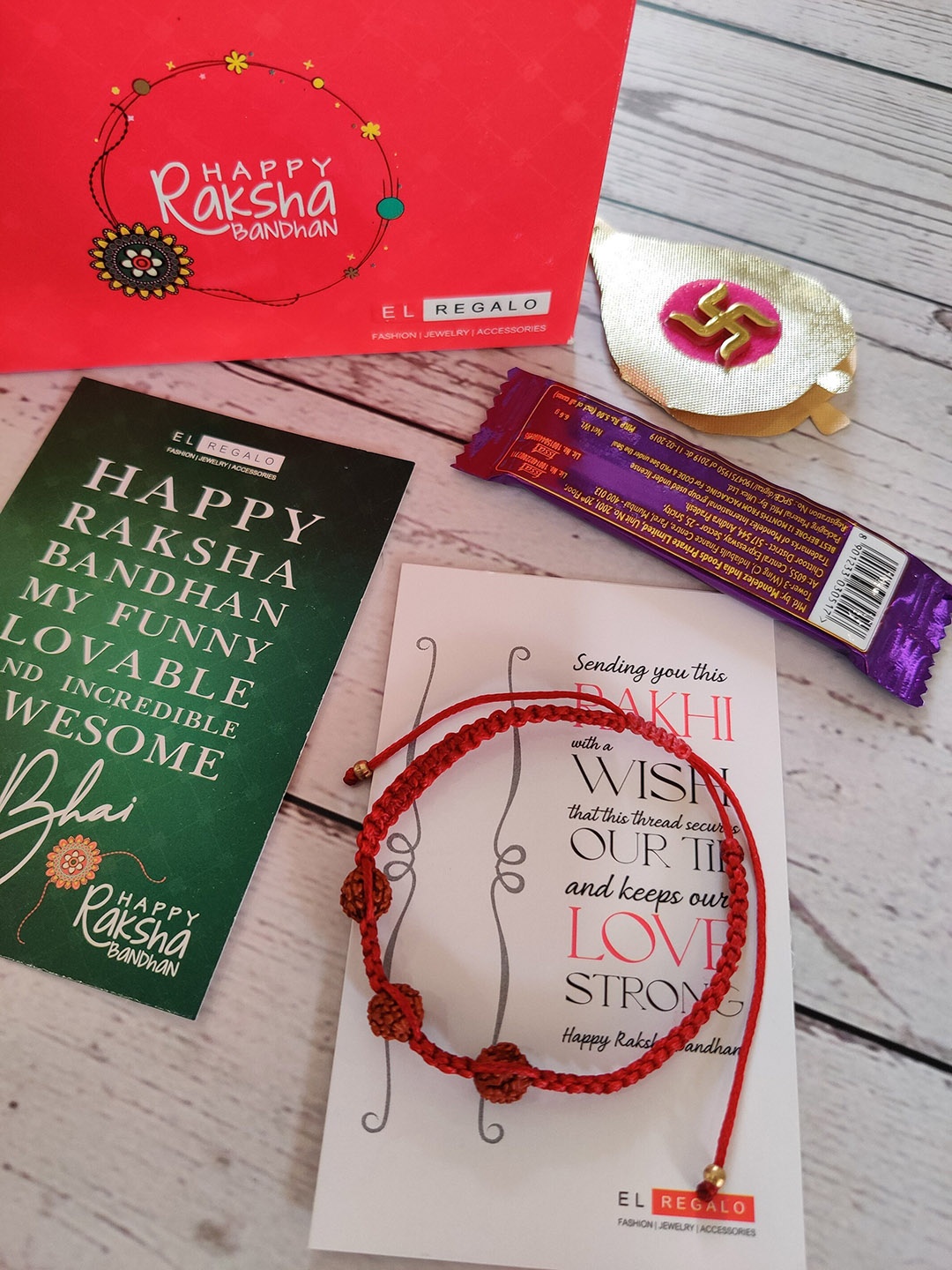 

EL REGALO Maroon Wraparound Rakhi with Card and Roli Chawal