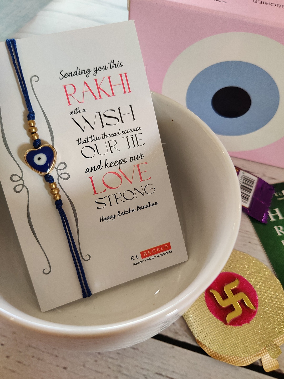

EL REGALO Navy Blue & Gold-Toned Rakhi with Card and Roli Chawal