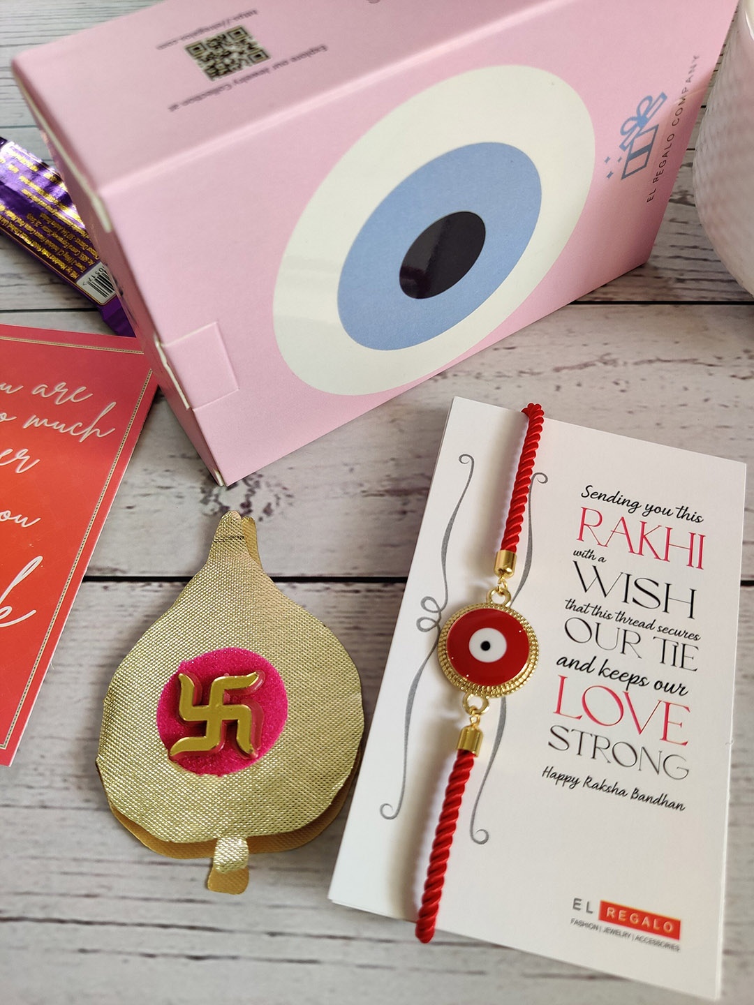 

EL REGALO Gold-Toned & Red Evil-Eye Charm Rakhi With Roli Chawal