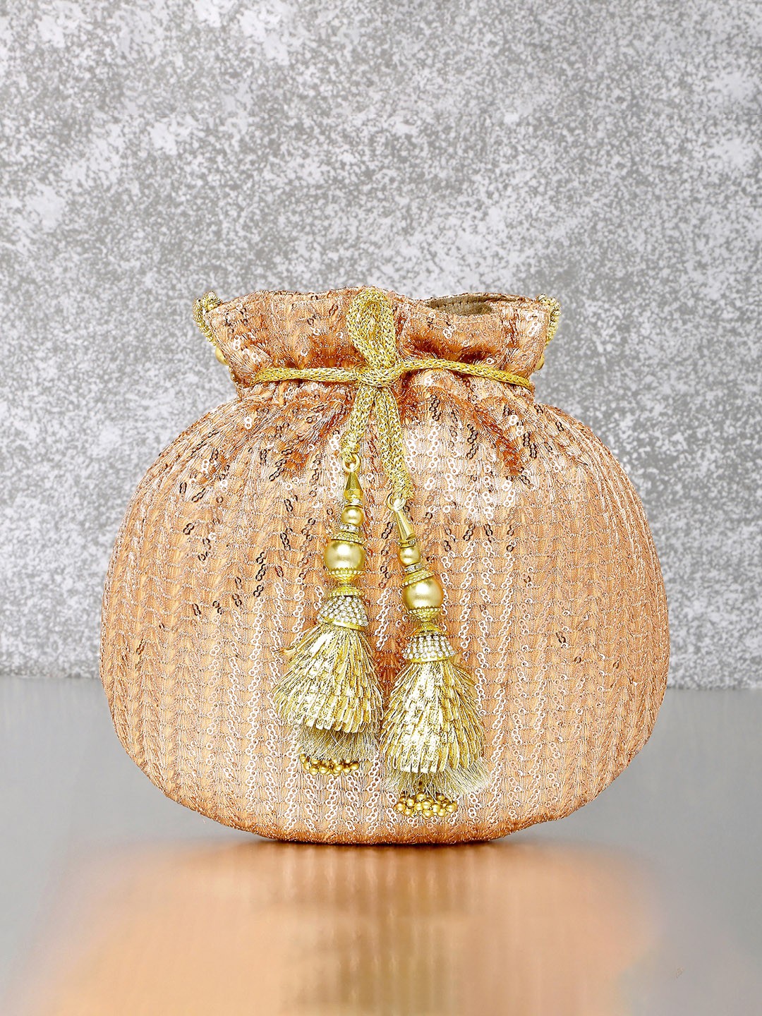 

Peora Rose Gold Embellished Tasselled Potli Clutch