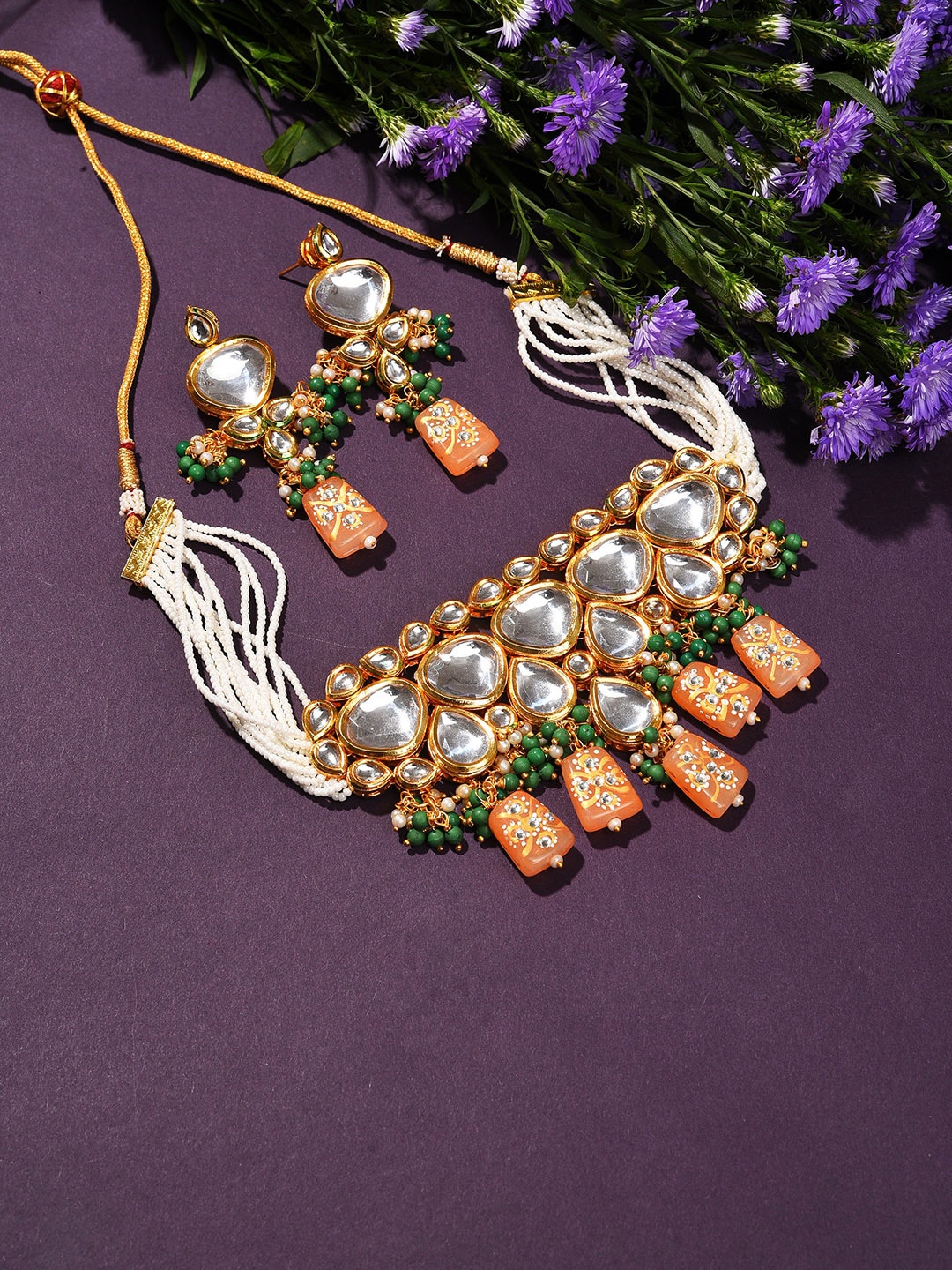 

SOHI Women Gold-Plated White Kundan Studded & Green & Orange Beaded Jewellery Set