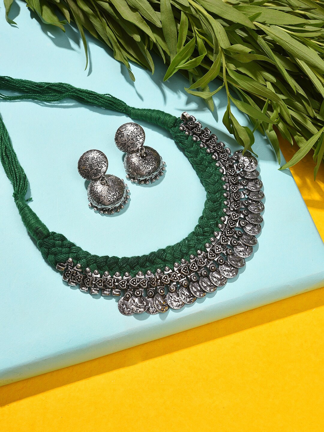 

SOHI Women Silver-Plated Green Stone-Studded & Beaded Jewellery Set