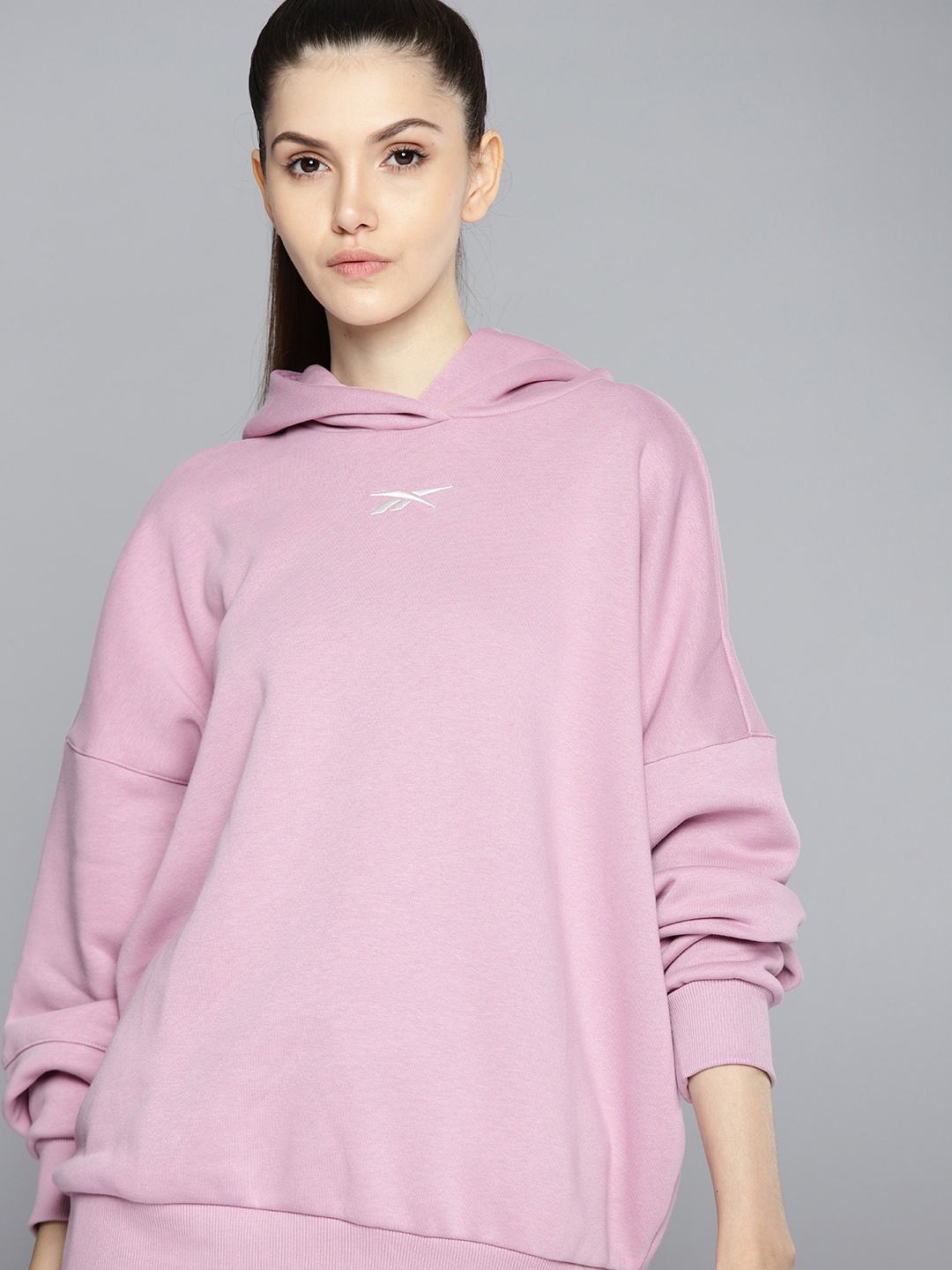 

Reebok Women Lavender Hooded Studio Solid Sweatshirt