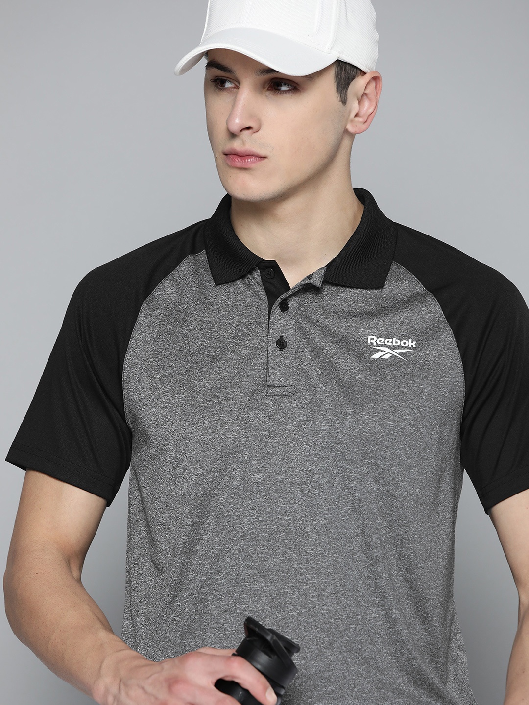 

Reebok Men Colourblocked Polo Collar Speedwick T-shirt, Grey melange