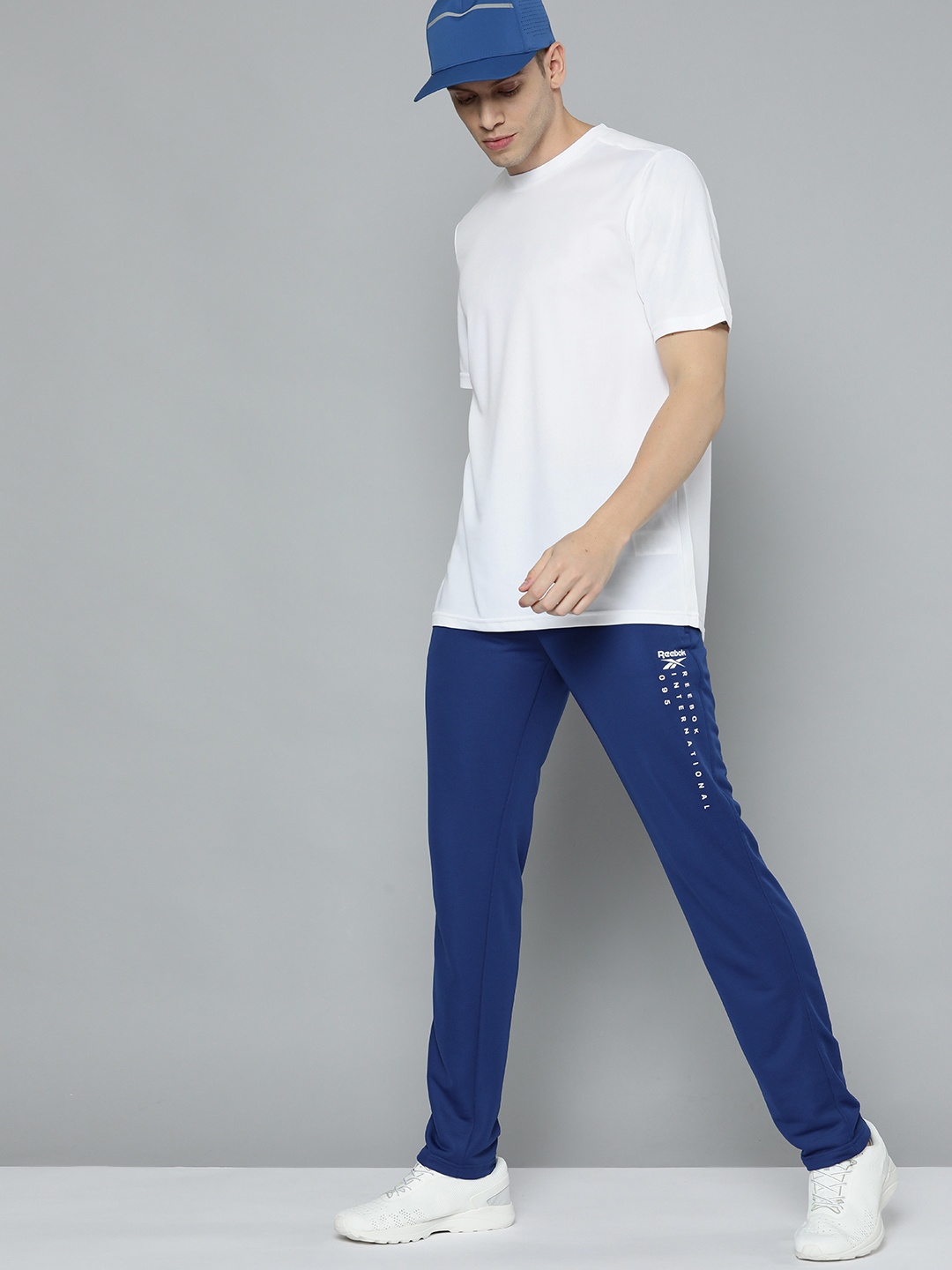 

Reebok Men Blue Solid ADV Track Pants