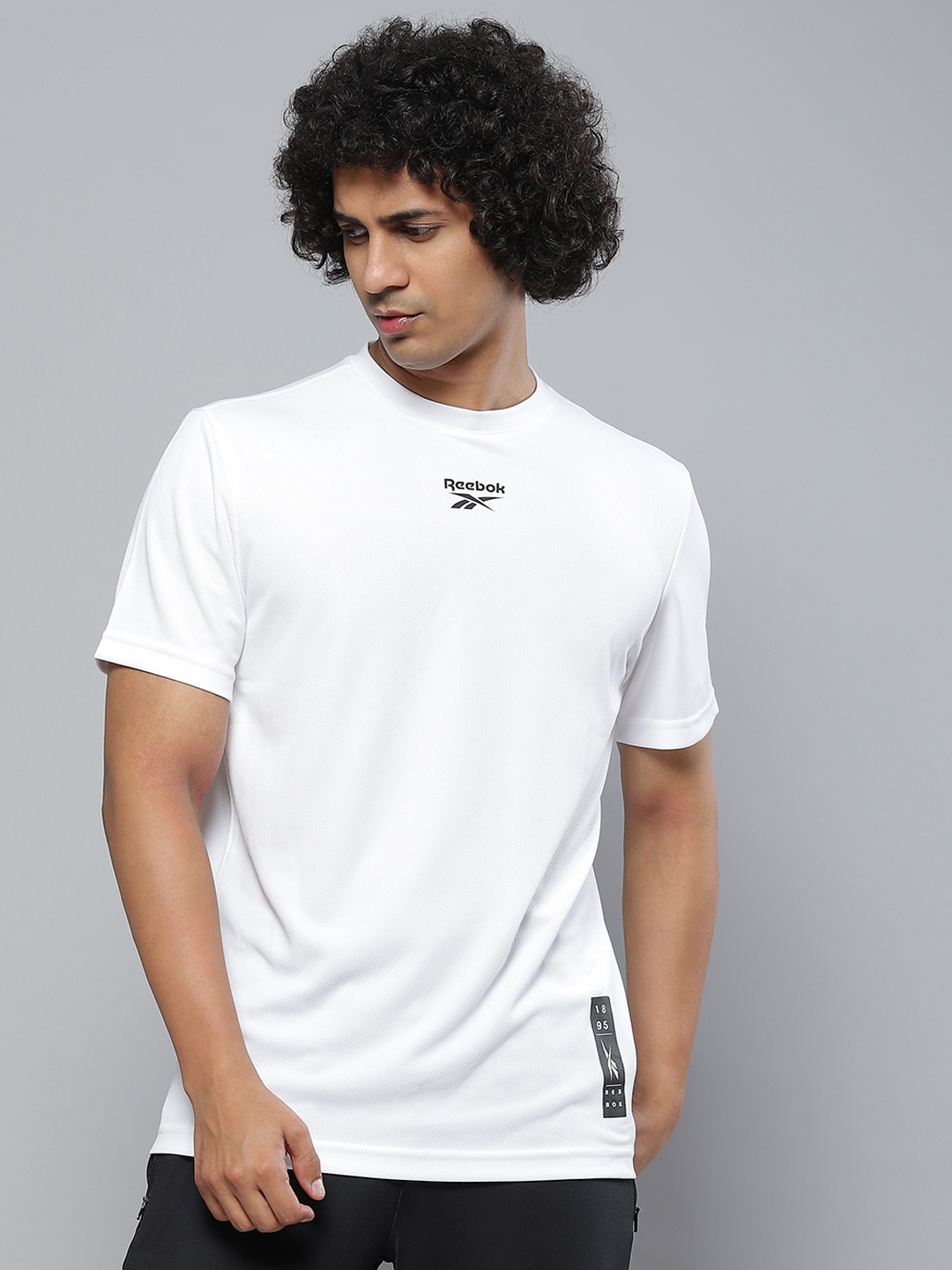

Reebok Men White Printed Slim Fit T-shirt
