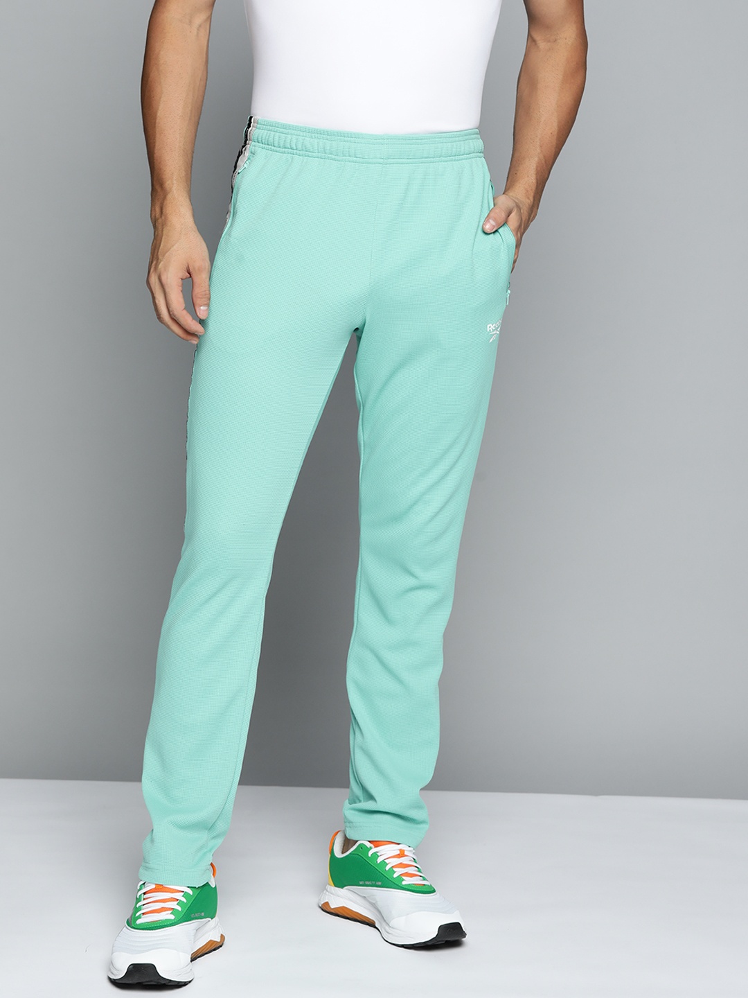 

Reebok Men Turquoise Blue Training Track Pants