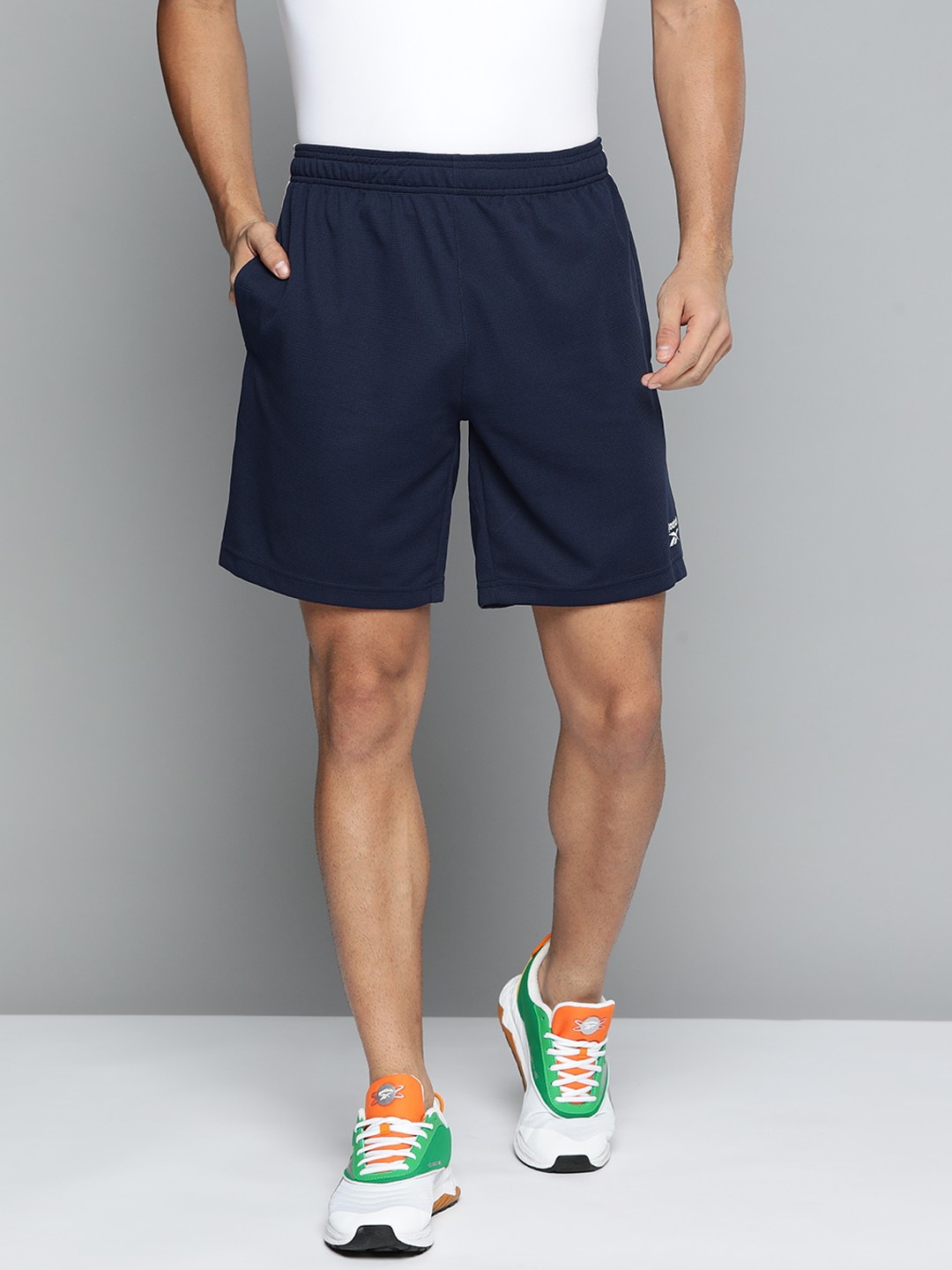 

Reebok Men Navy Blue Printed Training or Gym Sports Shorts