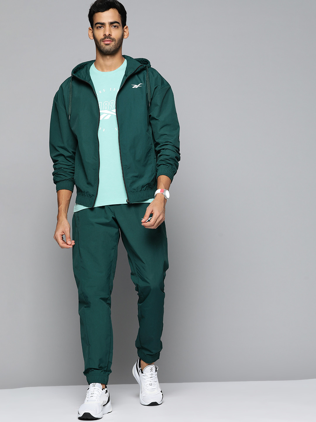 

Reebok Men Green Solid Workout Ready Track Suit