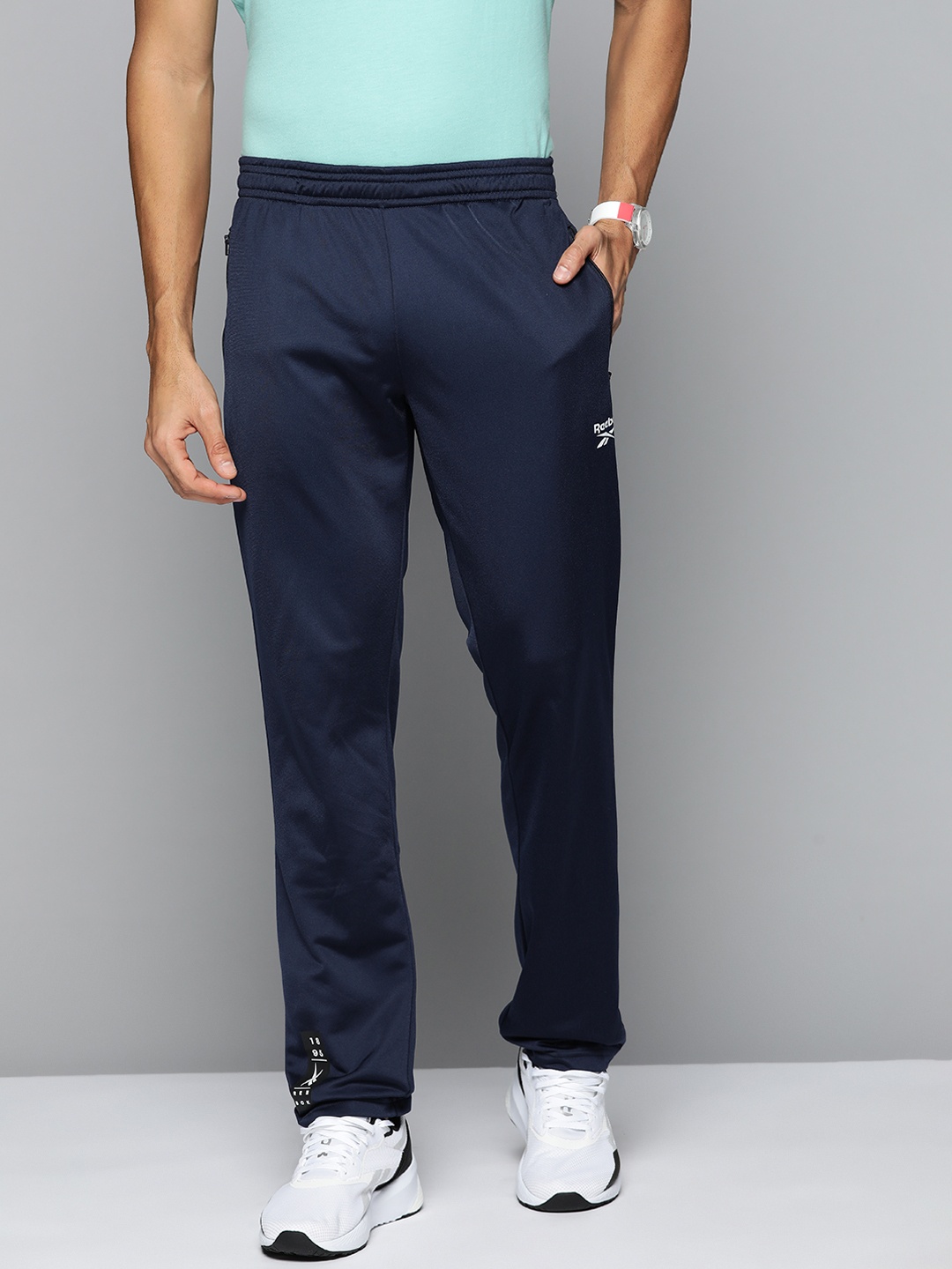 

Reebok Men Navy Blue Training Speedwick Track Pants