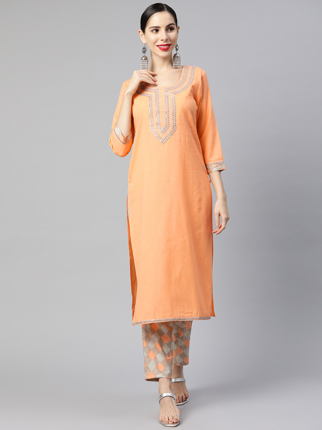 

Ramas Women Orange Ethnic Motifs Yoke Design Mirror Work Kurta with Trousers