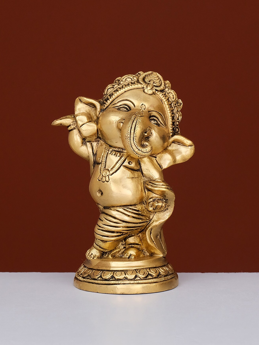 

Ekaa Handicrafts Gold-Toned Dancing Brass Ganesha Showpiece