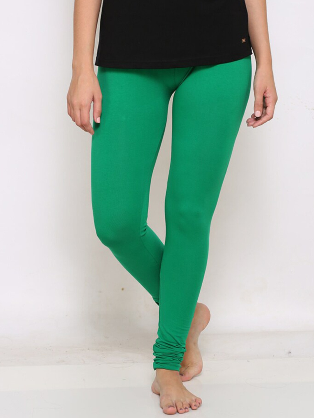 

Prag & Co Women Green Solid Super Combed Cotton Churidar-Length Leggings