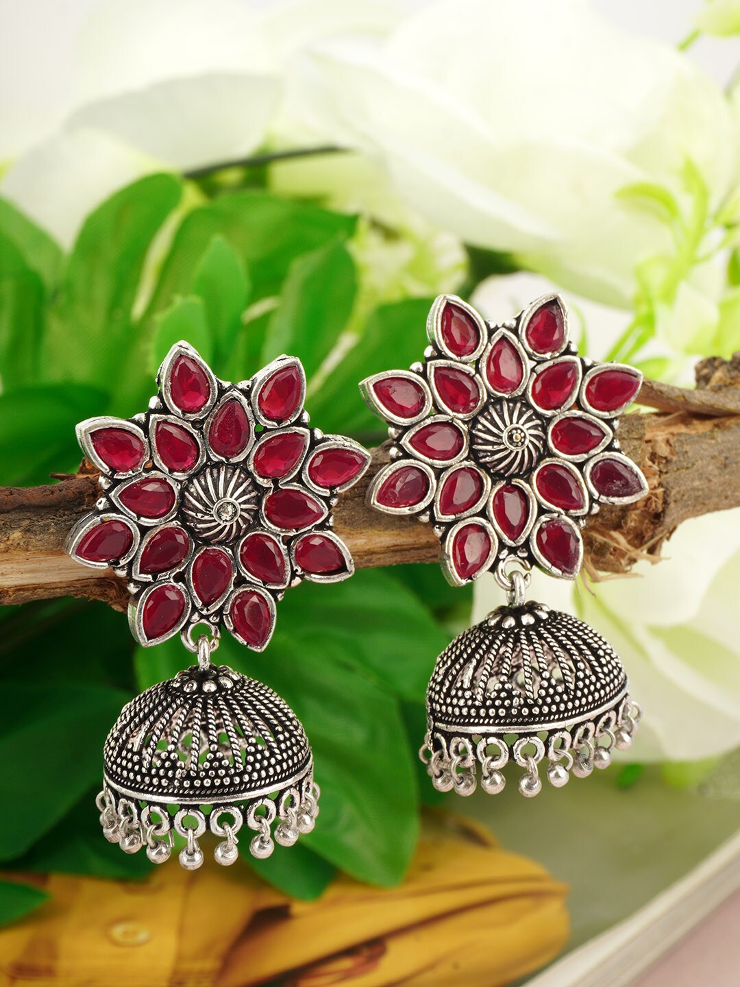 

Urmika Silver Red Stone Floral Classic Jhumkas Earrings