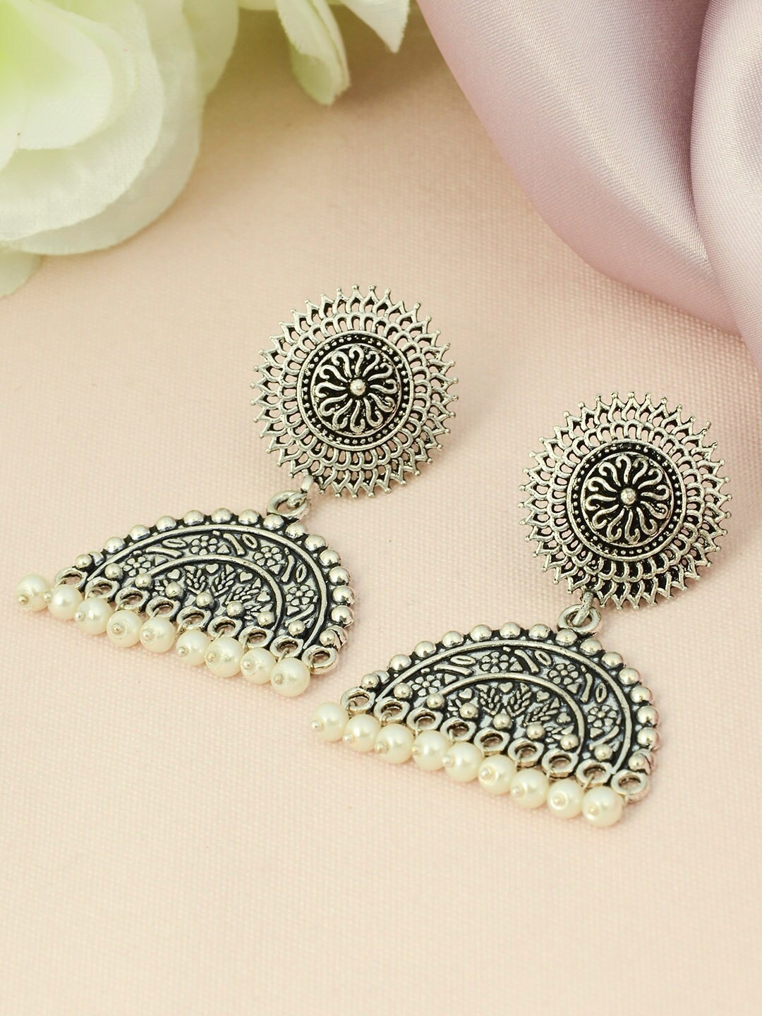

Urmika Cream & Silver-Toned Classic Jhumkas Earrings