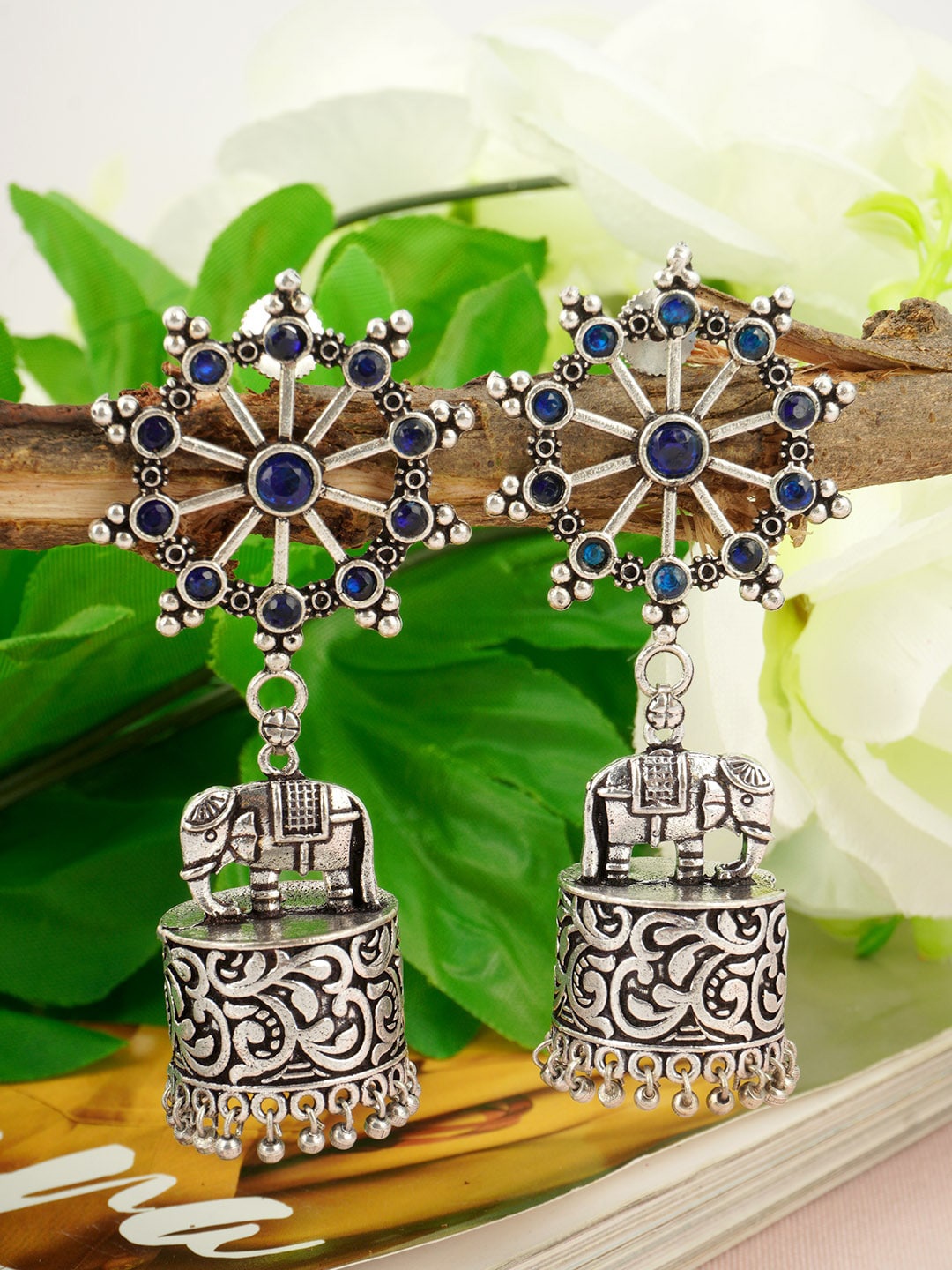 

Urmika Silver-Plated Blue Dome Shaped Oxidised Jhumkas Earrings