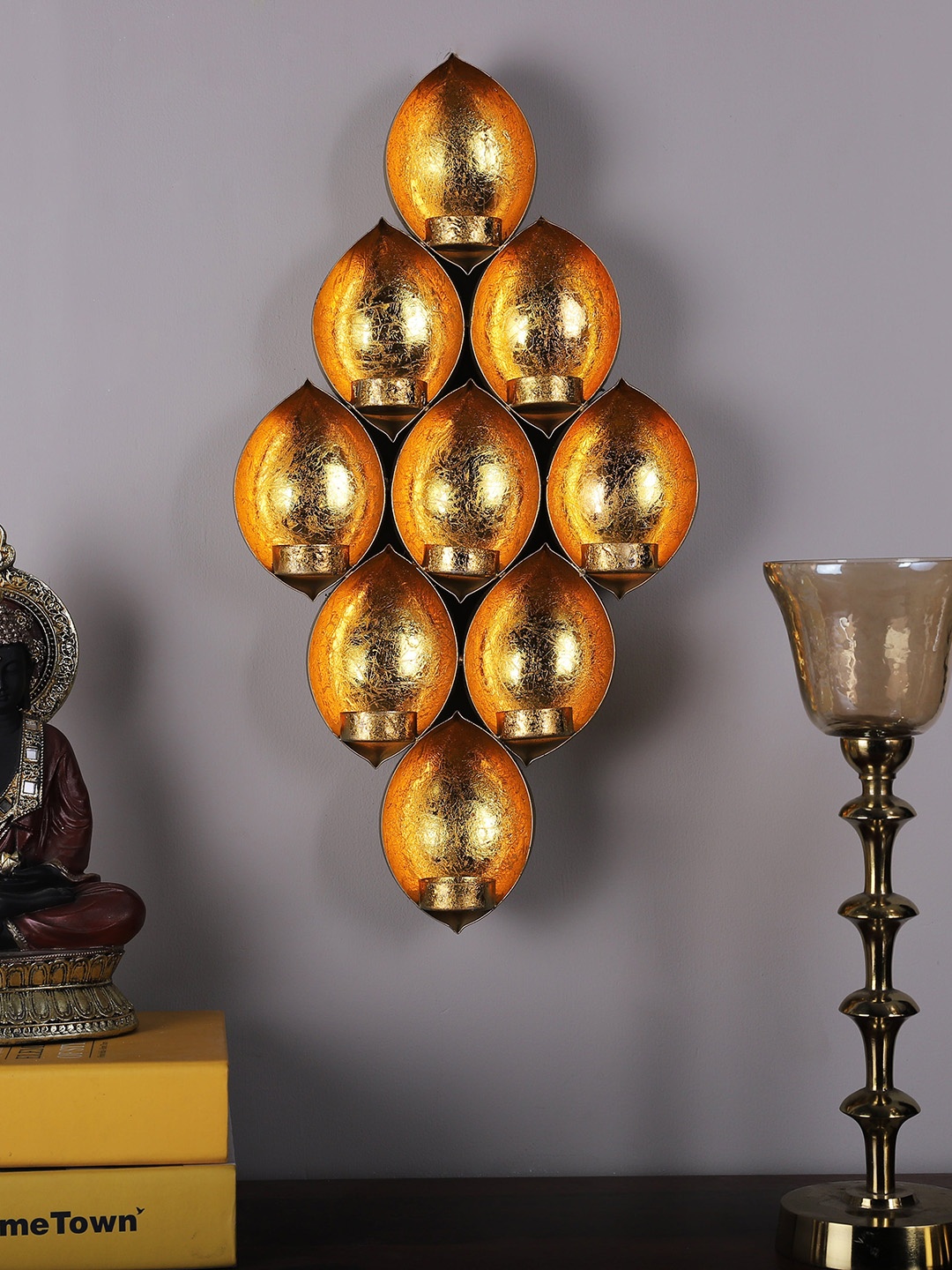 

HomeTown Gold-Toned Iron Wall Sconce Candle Holders