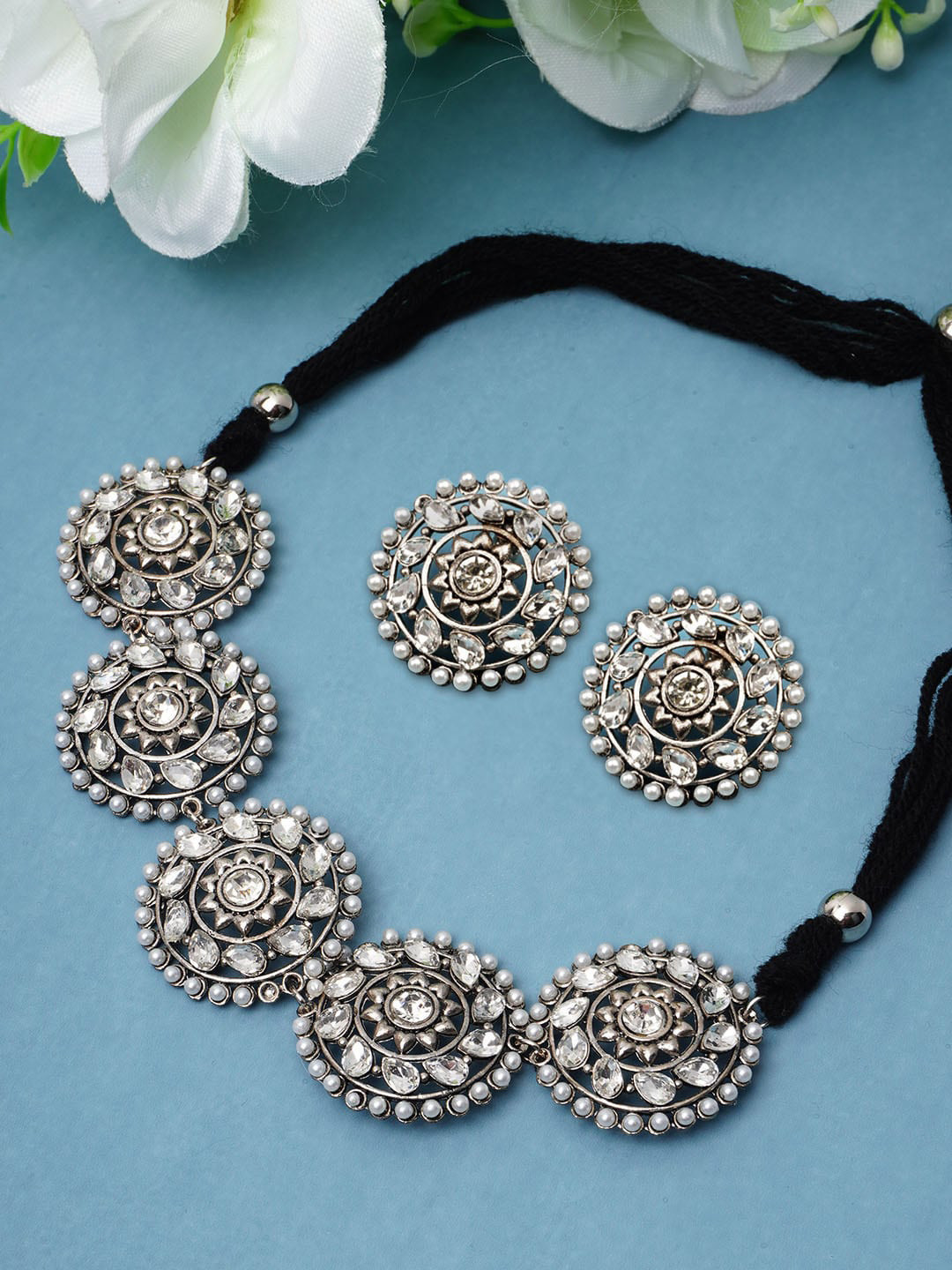 

Urmika Silver-Toned Crystal Studded Handcrafted Jewellery Set