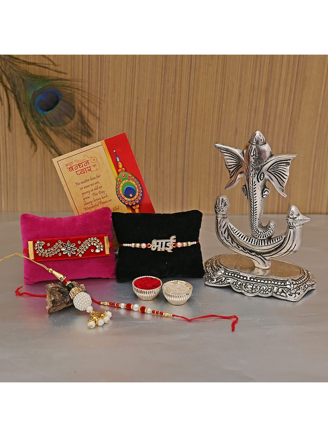 

CraftVatika Red & Silver-Toned Pack of 4 Rakhi, Greeting Card & Ganeshji Idol