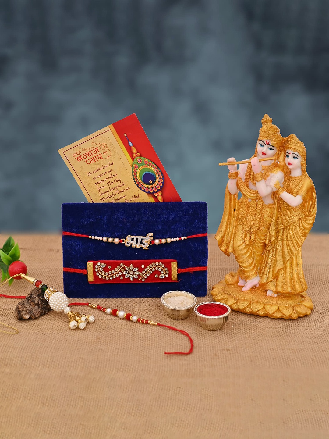 

CraftVatika Gold-Toned Rakhi With Radha Krishna Home Decor