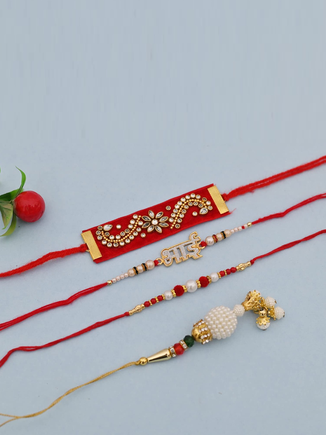 

CraftVatika Red & Gold-Toned Pack of 4 Rakhi, Greeting Card & Ganeshji Idol